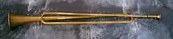 Slide trumpet replica. When trumpets only had a narrow range of playable notes, the slide trumpet allowed that range to increase. The tube that slides is where the mouthpiece enters; pulling it in and out changes the length of the trumpet, changing its key.