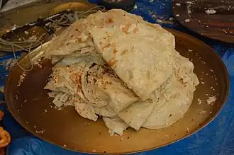 Petai paratha (“smashed paratha”), a West Bengal variant served with light vegetable curry