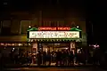 Following the end of a film showing, audience are exiting the theatre