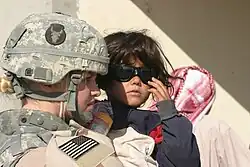 A soldier with the SSI of the 34th Infantry Division on her MICH TC-2000 Combat Helmet.