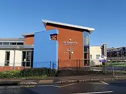 A photograph of the exterior of St Sidwell's Church of England Primary School, Exeter, including its bell-tower.