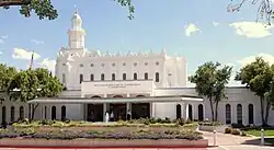 The St. George temple in the background, with the annex in the foreground, a garden can be seen in the front.