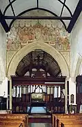 Chancel arch and painting of the twelve apostles.