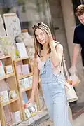 American girl wearing barrel leg overalls, 2024