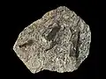 Staurolite growing as porphyroblasts in a mica schist
