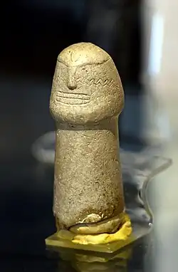 Phallic sculpture with engraved human figure. Nemrik (7800–6500 BC). National Museum of Iraq - Baghdad.[10]
