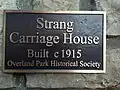 Second exterior plaque by entrance