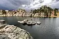 Rock wall damming the northwest side of Sylvan Lake
