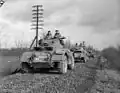 T-17E1 Staghound armoured cars of "A" Squadron, 12th Manitoba Dragoons, in the Hochwald, Germany, 2 March 1945. The first car has tire chains on all four wheels.