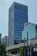 TV Asahi EX Tower in 1 Nishi-Azabu neighboring Roppongi, viewed from Roppongi Hills, over the Roppongi-dori (Roppongi street).
