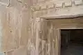 Royal tomb entrance (Tomb 5) with volute (proto-Aeolic) capital, recessed door, lintel, stone imitation of rectangular roof beams[5]