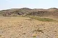 Looking across the small ravine that contains the petroglyphs