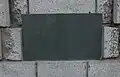 Plaque on a memorial to workers who died during the construction of the Tay Road Bridge