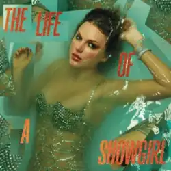 Taylor Swift lying in a bathtub with her face half-submerged in water. Fragments of images of her body are scattered near the borders.