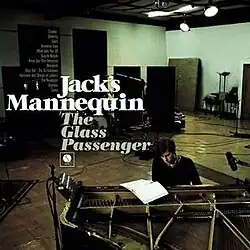 Andrew McMahon playing a piano inside a recording studio