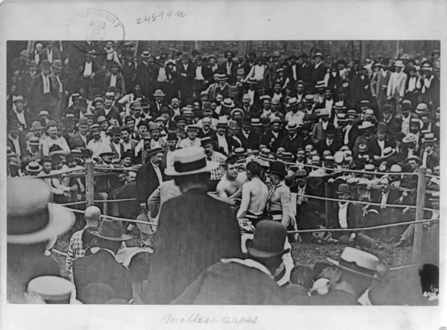 John L. Sullivan stares down Jake Kilrain seconds prior to their prizefight.