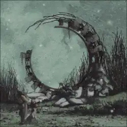 A drawing of a large, mechanistic, decrepit circular construct in the middle of a dark, grassy field in nighttime, with taller grass around and behind the construct and two people staring at the construct from the front-left.