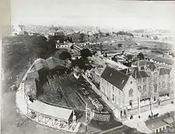 Sydney's first Tramways depot, corner of Pitt Street and what was then Gipps St West and Garden Road, looking SE across the Old Cemeteries towards Surry Hills. Eddy Avenue roughly follows Garden Road,[25] c. 1880.