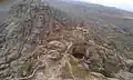 Top of the mountain showing half side of the fortification (Arabic: حِصْن ٱلْغُرَاب, romanized: Hiṣn Al-Ghurāb)