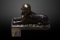 The Bronze Sphinx of Thutmose III, depicting a sphinx reclining over the Nine Bows