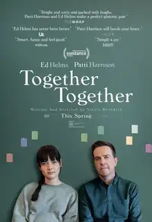 Anna and Matt sit side by side looking at the viewer. Anna has long brunette hair with bangs. Her hair is in a loose braid over her shoulder, she wears a baggy grey sweatshirt, under which you can see the faint outline of the top of her pregnant belly. Matt sits beside her, close enough that their shoulders are touching. His dark hair is neatly cut and he wears a fell-fitted dark blue chambray button down shirt with a collar. They are looking straight ahead; openly, honestly, comfortably, and knowingly. The background is a blueish green color, the way copper looks when it's oxidized. There are a few small rectangular paint-chips in different colors behind them, as though taped to a wall. Above them in white type the title of the film "Together Together" in a serif font. Above that in smaller type are 5 quotes from reviews and the Sundance imprint. The film is rated R.