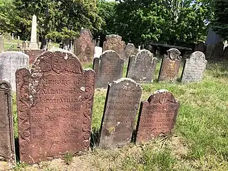Overlooking a number of brownstone and schist markers