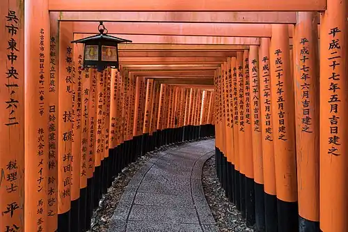 Thousands of torii gates line the paths of the celebrated Fushimi Inari Shrine in Kyoto, Japan