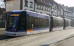 Blue and white three-section tram