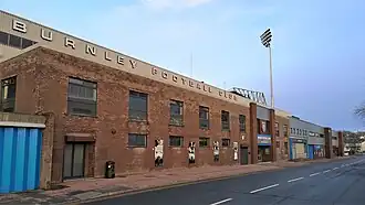 A football stand photographed from a road