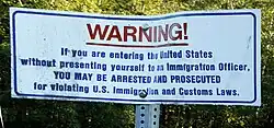Notice at the international boundary between Canada and the United States in Point Roberts