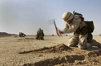 US Navy Seabees digging 'hasty scrapes', 2003.
