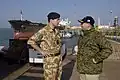 Desert Combat Dress worn by a Royal Navy officer on the left, in 2006.