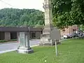 Various signs by the monument