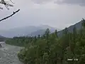 A river with the Ural Mountains in the background, Berezovsky, Khantia-Mansia, Russia Urals