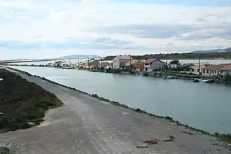 Canal du Rhône à Sète between two marshes at Les Aresquiers
