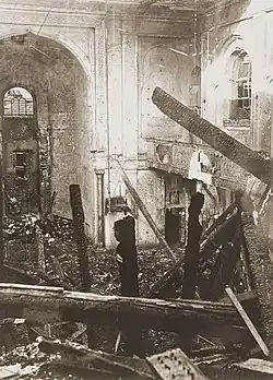 A building that has been ransacked with debris strewn around