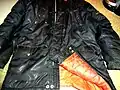 A vintage Lord Anthony snorkel parka surviving after 30 years. It is now rather grubby and the nylon shell is shiny from wear but it's still a warm functional jacket.