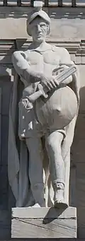 Marble statue of man in Roman legionary armor