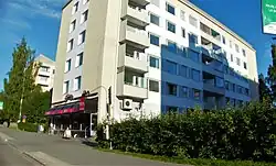 An apartment building and a pub on street Voionmaankatu.