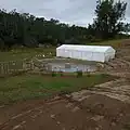 View of Wallacia Mandi's main baptismal pool, located adjacent to the Nepean River (in the background), in June 2024