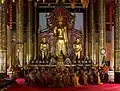 Monks chanting inside the viharn