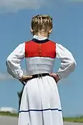 Girl in a white juppe (back)