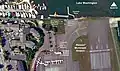 Area overview of the Will Rogers–Wiley Post Memorial Seaplane Base showing the perimeter fence restricting access, nearby streets, the Cedar River, U.S. Customs building, and memorial marker