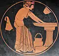 Kalē woman bathing at the laver, with a water bucket, a skyphos, and a wineskin, c. 500 BC