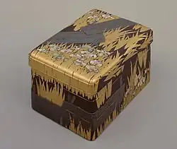 Inlaid maki-e raden writing Box with "Eight Bridges" ( yatsuhashi ) design, by Ogata Kōrin, National Treasure, Edo period, 18th century. The flowers are abalone shell inlays. Tokyo National Museum[10]