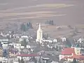 A closer view of the village from the castle, with the Church of Saint Margaret of Antioch seen prominently (March 2012)