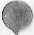 Bronze mirror depicting the Judgement of Elcsntre. Figures from left to right: Elcsntre, Uni, Menrva, unknown.