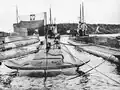The three submarines Sęp, Ryś, and Żbik at the Marielund internment camp outside Mariefred, with the Polish flag raised on one of them.