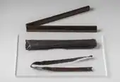 Wooden rod with central hinge and its case