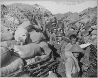 Black and white historical photograph showing film crew at World War I trench